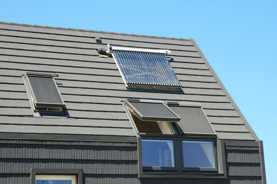 Modern House Roof with Solar Water Heater, Solar Panels and Skylights