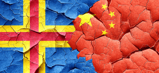 aland islands with China flag on a grunge cracked wall