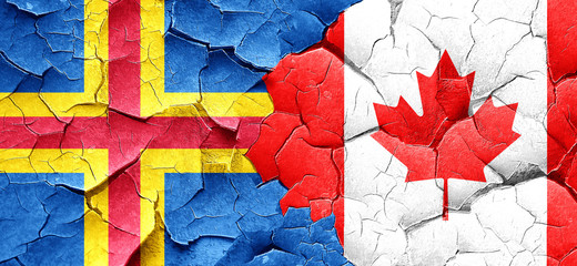 aland islands with Canada flag on a grunge cracked wall