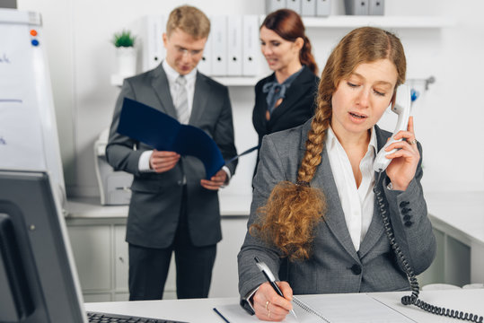 business woman speaking at telephone in office