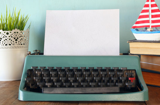 photo of vintage typewriter with blank page