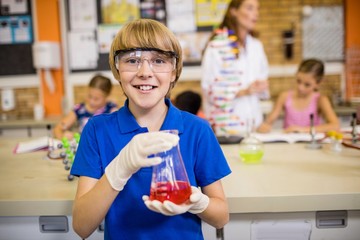 Child posing with a chemical liquid
