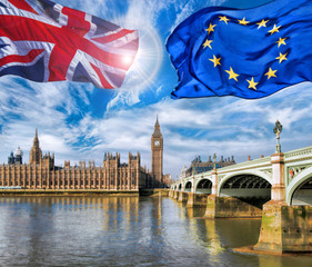 European Union and British Union flag flying against Big Ben in London, England, UK, Stay or leave,...