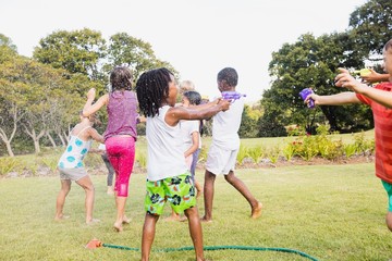 Fototapeta premium Kids playing together during a sunny day