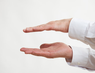 Obraz premium Male hand showing a fatness