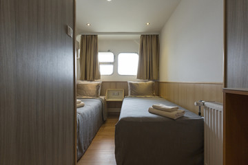 Interior of a cabin bedroom on cruise boat hotel