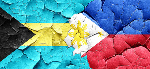 Bahamas flag with Philippines flag on a grunge cracked wall