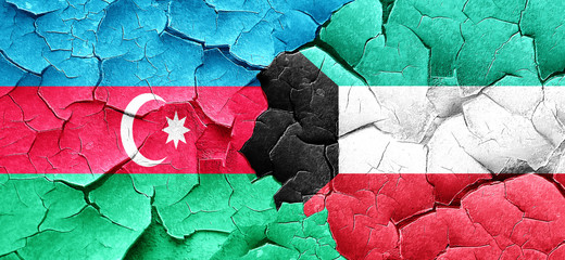 Azerbaijan flag with Kuwait flag on a grunge cracked wall