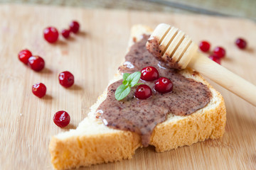 Sandwiches with cream honey and cranberries