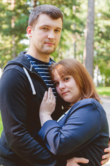 Fototapeta premium Cheerful Romantic Couple in Love Huging Together