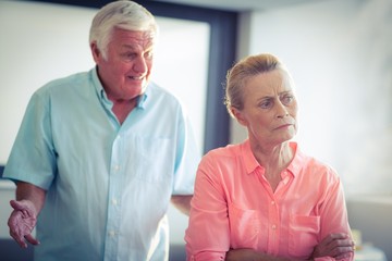 Senior woman ignoring a senior man while argument