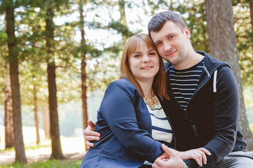 Obraz premium Cheerful Romantic Couple in Love Huging Together