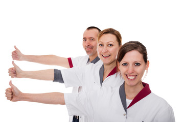 Pflegekräfte mit Daumen hoch, isoliert