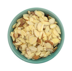 Bowl filled with sliced almonds isolated on a white background top view.