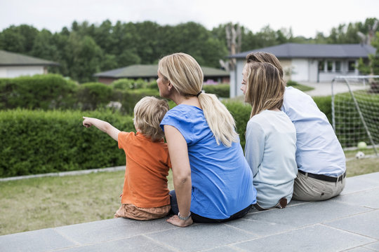 Family sitting together and looking at view