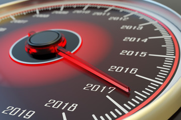 New year coming and passing time concept, car dashboard speedometer dial with past years and arrow approach 2017