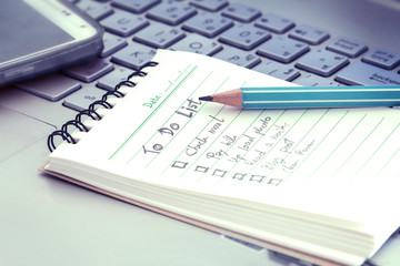 close up Handwritten to do list plan in small note book