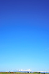 Fototapeta na wymiar Daisetsuzan seen from Asahikawa , Blue sky , with copy space , m