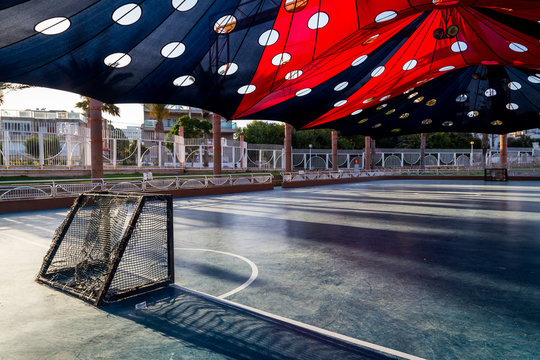 mini hockey field with a colorful sunshade in a city recreation park in Nahariya 