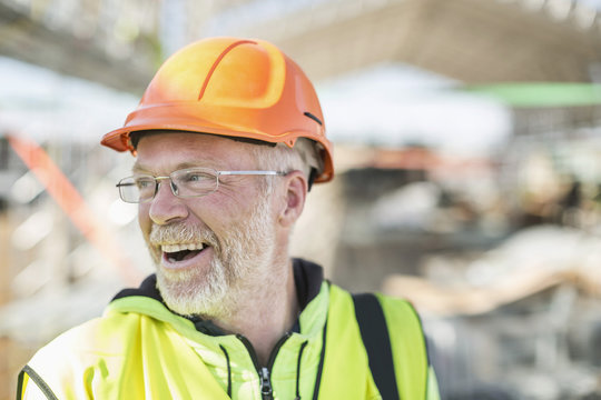 Happy construction worker at construction site
