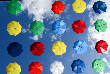 Many colorful umbrellas hanging on the pedestrian street of Chia