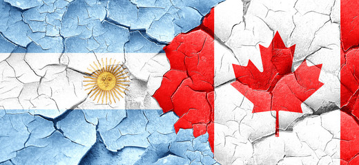Argentina flag with Canada flag on a grunge cracked wall