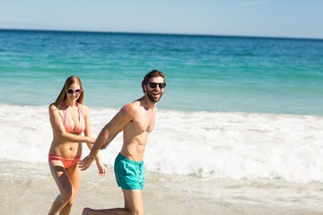 Couple walking on beach