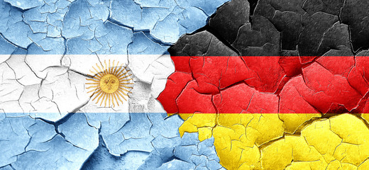 Argentina flag with Germany flag on a grunge cracked wall