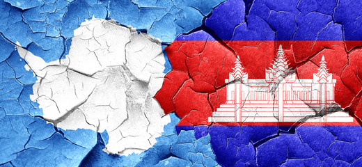 antarctica flag with Cambodia flag on a grunge cracked wall