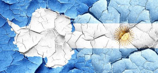 antarctica flag with Argentine flag on a grunge cracked wall