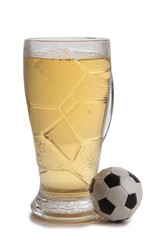 Glass beer mug and a ball on a white background