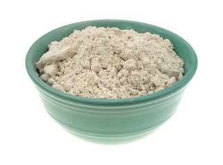 Caramel cake mix in a bowl side view isolated on a white background.