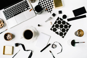 flay lay composition for bloggers, artists, magazines and social media. freelancer black style workspace with laptop, black coffee, sketchbook, napkins, ribbons, paintbrushes on white background.