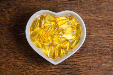 fish oil in heart shape bowl - 113325369