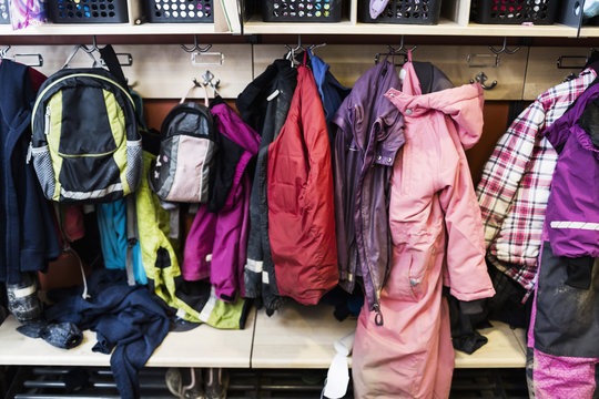 Winter coats and backpacks in wardrobe at kindergarten