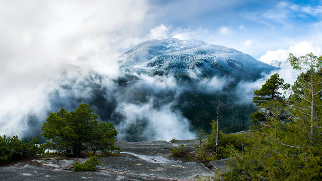 At the level of clouds and on the background beautiful mountains