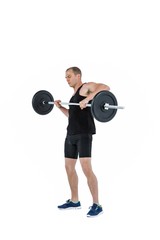 Bodybuilder lifting heavy barbell weights