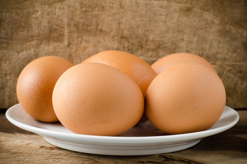 Eggs on wooden background,food ingredient