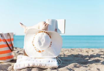 Obraz premium Reading on Beach