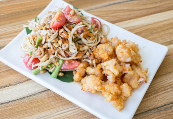 Green papaya salad with shrimp, fried food, spicy Thailand.