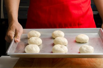 Bun dough ready to bake on baking tray