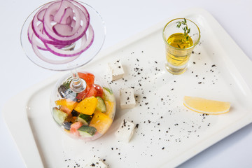 Fototapeta na wymiar Greek Salad with graceful submission