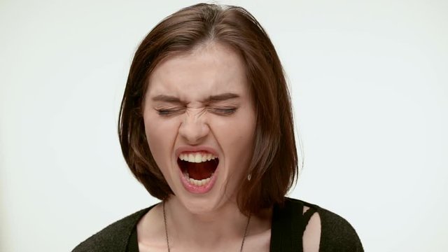 Sleepy tired girl yawning. Close up. Slow motion