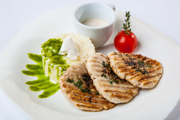 medallions of pork with rice and sauce