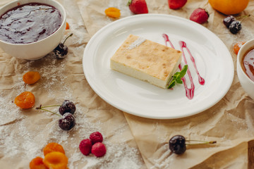 Casserole on parchment background.