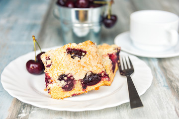 Slices of home made butter cherry cake with crumble topping