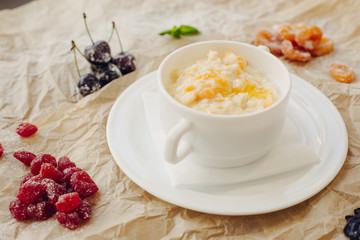 Millet porridge with pumpkin. Parchment background.