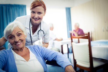 Fototapeta premium Portrait of nurse with a senior woman 