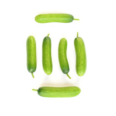 Fresh mini cucumbers isolated on white background