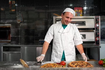 Foto op Plexiglas cook at table preparing a fresh pizza © Аrtranq